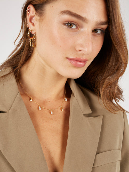 Liri necklace - a classic and delicate necklace with five hanging marquise crystals. The necklace is plated with high quality 24K yellow gold plating.
